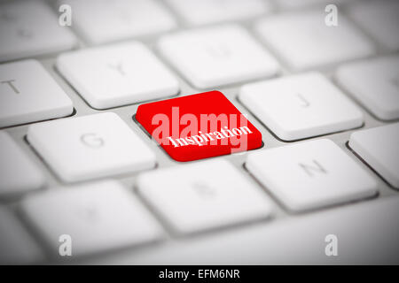 The word "INSPIRATION" written on metallic keyboard Stock Photo