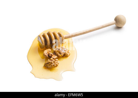 honey dipper and walnuts on white background Stock Photo