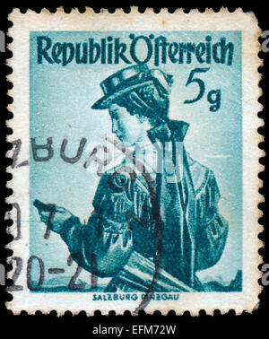 AUSTRIA - CIRCA 1949: a stamp printed in the Austria shows Woman from Salzburg, Pinzgau, Regional Costume, circa 1949 Stock Photo