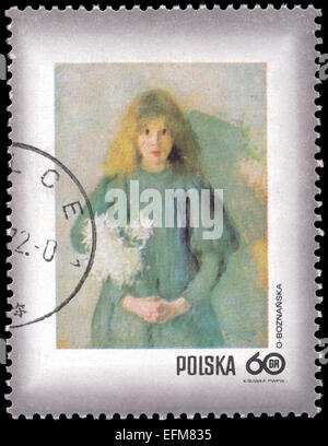 POLAND - CIRCA 1971: A stamp printed in Poland shows chrysanthemums young child by Olga Boznanska, circa 1971 Stock Photo