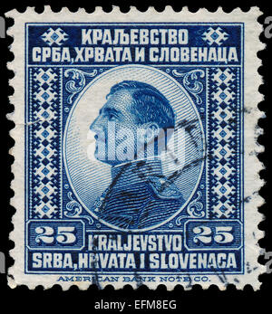 YUGOSLAVIA - CIRCA 1921: A stamp printed in Yugoslavia (Kingdom Serbia, Croatia and Slavonia) shows portrait of King Alexander I Stock Photo