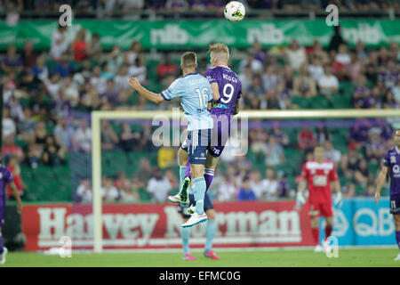 Perth, Australia. 7th February, 2015. Hyundai A-League, Perth Glory versus Sydney FC. Andrew Keogh wins the header against Alexander Gersbach. Credit:  Action Plus Sports Images/Alamy Live News Stock Photo