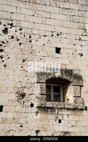 Bullet and shell holes in stone walls of Citadel building Budapest Stock Photo