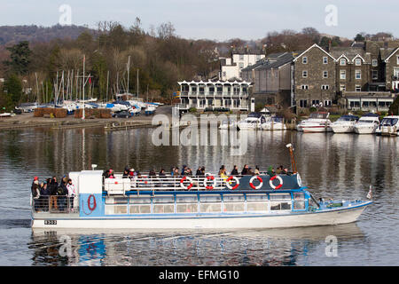 Lake Windermere Cumbria UK 7th  February  2015  Bright sunny cold day on  Lake Windermere . Bowness Bay with the Royal Windermere Yacht Club & Old England Hotel in the background .Passenger Cruises have busy day boats full inside and on top despite the cold , Credit:  Gordon Shoosmith/Alamy Live News Stock Photo