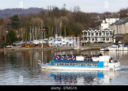 Lake Windermere Cumbria UK 7th  February  2015  Bright sunny cold day on  Lake Windermere . Bowness Bay with the Royal Windermere Yacht Club in the background .Passenger Cruises have busy day boats full inside and on top despite the cold , Credit:  Gordon Shoosmith/Alamy Live News Stock Photo