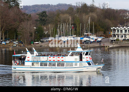 Lake Windermere Cumbria UK 7th  February  2015  Bright sunny cold day on  Lake Windermere . Bowness Bay with the Royal Windermere Yacht Club in the background .Passenger Cruises have busy day boats full inside and on top despite the cold , Credit:  Gordon Shoosmith/Alamy Live News Stock Photo