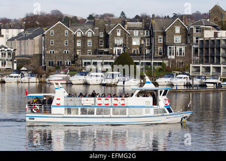 Lake Windermere Cumbria UK 7th  February  2015  Bright sunny cold day on  Lake Windermere . Bowness Bay with the Old England Hotel in the background .Passenger Cruises have busy day boats full inside and on top despite the cold , Credit:  Gordon Shoosmith/Alamy Live News Stock Photo