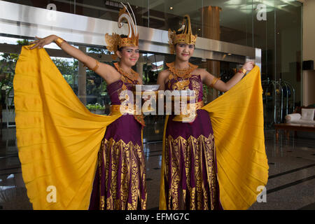 Two local Balinese girls dressed in traditional costumes Stock Photo