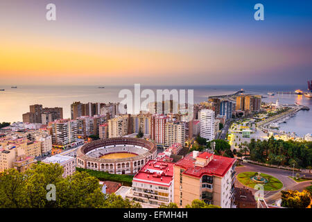 Malaga, Spain dawn skyline towards the Mediterranean Sea. Stock Photo