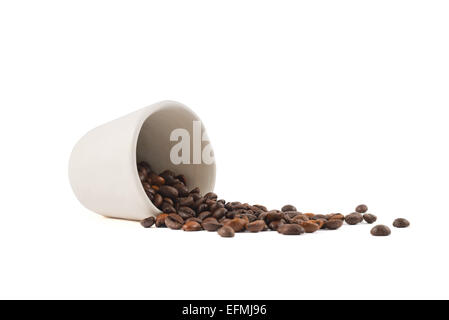 Spilled coffee beans from the cup isolated Stock Photo