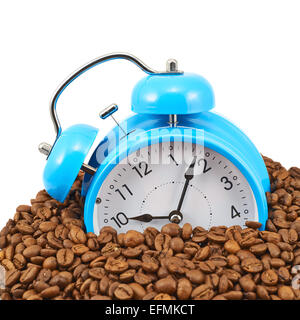 Blue alarm clock buried in beans Stock Photo