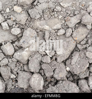 Dried soil covered with stones and dust Stock Photo