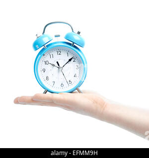Caucasian male hand holding alarm clock Stock Photo