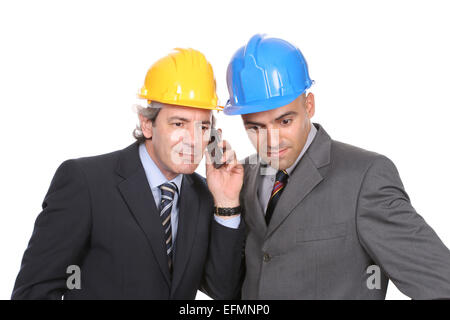 Two Engineers or Architects, on the phone, isolated in white background Stock Photo