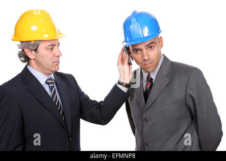 Two Engineers or Architects, on the phone, isolated in white background Stock Photo