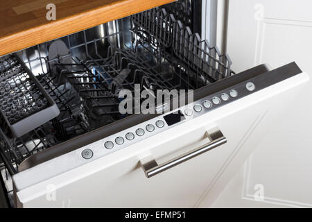 modern Half open empty dishwasher in a modern kitchen Stock Photo