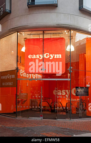 Easy gym birmingham central with orange coloured entrance Stock Photo