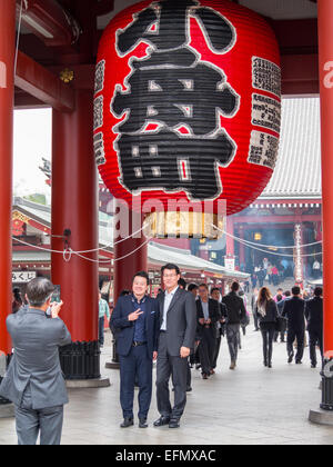 Taking pictures under Senso-ji temple great red lantern Stock Photo