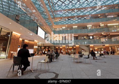 Japan Post (JP) Tower shopping mall with glass roof in Maranouchi, Tokyo, Japan Stock Photo