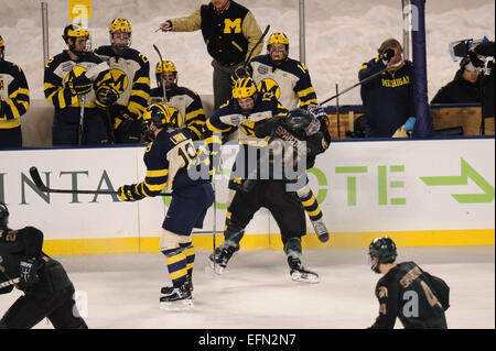 Chicago, Illinois, USA. 07th Feb, 2015. February 7, 2015: Michigan State's Michael Ferrantino (20) checks Michigan's Zach Werenski (13) during the Coyote Logistics Hockey City Classic NCAA hockey game between the Michigan State Spartans and the Michigan Wolverines at Soldier Field in Chicago, IL. Michigan won 4-1. Patrick Gorski/CSM Credit:  Cal Sport Media/Alamy Live News Stock Photo