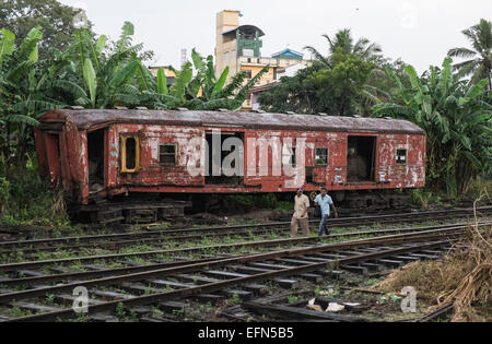 Old train carriage abandoned,unwanted,rusting rusty on tracks near Colombo train station,Colombo,Sri Lanka,South Asia,Asia. Stock Photo