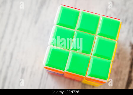 https://l450v.alamy.com/450v/efn726/jigsaw-puzzle-rubik-cube-toy-multicolor-plastic-blocks-on-white-wooden-efn726.jpg