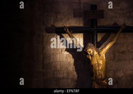 Old medieval crucifix in Italian church - made of wood Stock Photo