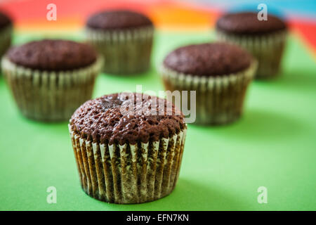 Mini chocolate brownie cupcakes on colorful background Stock Photo