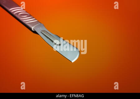 Stainless steel surgical scalpel blade instrument used to make cuts or  incisions in surgery Stock Photo - Alamy