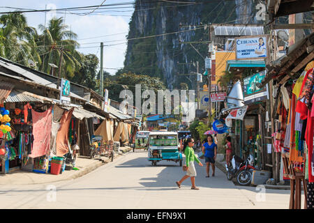 El Nido, Palawan - January 16, 2015: main street of El Nido in Palawan, one of the main islands in the Philippines. Tricycles an Stock Photo