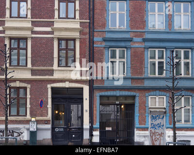 Two apartment blocks, red brick with yellow and blue frames, Grunerlokka / Trondheimsveien, Oslo Norway Stock Photo