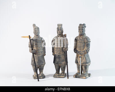 Miniature 'terracotta warriors' , souvenir statues carved in stone isolated on white, originally from Xian China Stock Photo