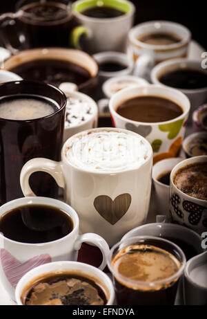 Lots of coffee in different cups with hearts. Stock Photo