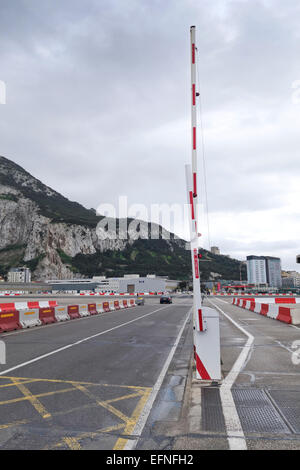 Cars and pedestrians cross the runway of Gibraltar airport at the border of Spain to enter Gibraltar. Uk. United Kingdom. Stock Photo