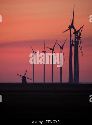 Sunset over the wind turbines in Eemshaven, The Netherlands Stock Photo