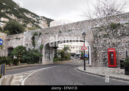 Gibraltar rock. Referendum Gate at Southport Gates in Charles V Wall, Red british phone booth. Gibraltar. United Kingdom. Stock Photo