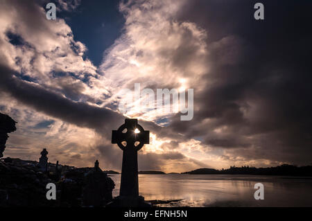 Dramatic light at sunset by Old Abbey Cemetery and Donegal Bay in Donegal Town County Donegal Ireland