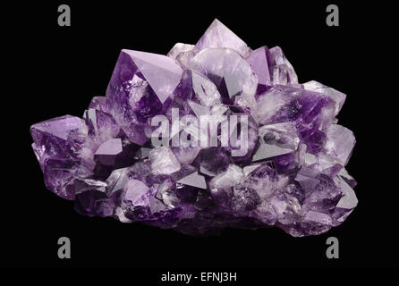 Amethyst over black background, a violet variety of quartz, often used in jewelry. Silica, silicon dioxide, SiO2. Stock Photo