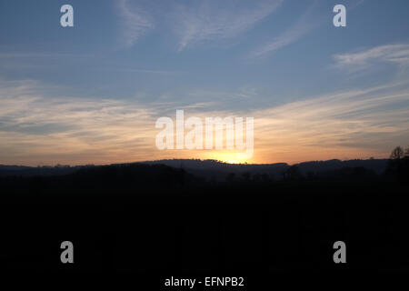 Sunset on a winters day when the sun shined all day Stock Photo