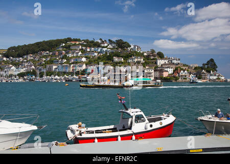 Kingswear from Dartmouth, South Hams, Devon, south-west England, UK, couple relaxing in small pretty boat moored in foreground Stock Photo