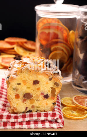 Christmas holly fruitcake on the table Stock Photo