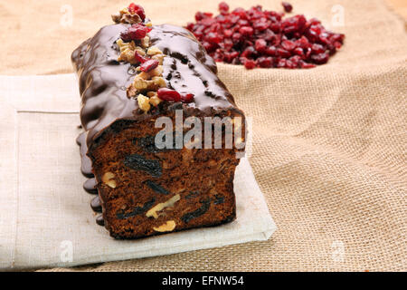 Christmas cake with dried plums and chocolate icing Stock Photo