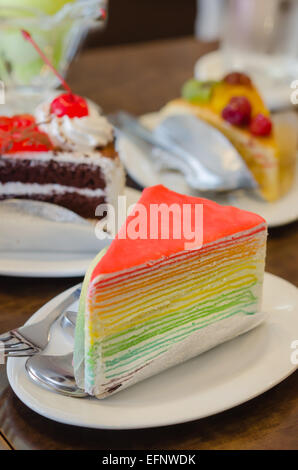 Rainbow crepe cake served , dessert on dish Stock Photo