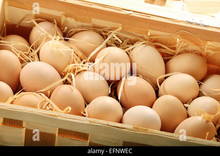 Fresh eggs in wooden box Stock Photo