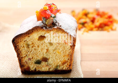 Christmas holly fruitcake on the table Stock Photo