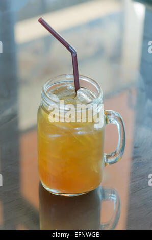 ice tea with drinking straw on the table Stock Photo