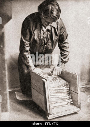 With paper at 9d. per pound, housewives stored old newspapers for re-sale to fishmongers etc during World War One. Stock Photo