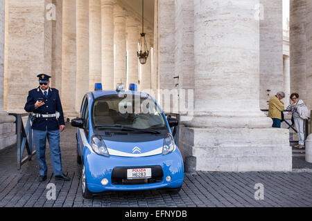 A small car Police on patrol with police man in the square in Vatican City in Rome, Italy Stock Photo