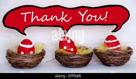 Three Red Dotted And Striped Easter Eggs In Easter Baskets Or Nest On White Wooden Background With Comic Speech Balloon With Eng