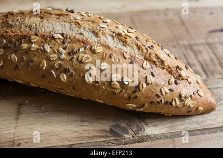 bread with seeds and nuts, on wood grunge background Stock Photo